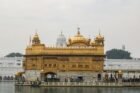 Captivating view of the Golden Temple, Amritsar reflecting in the surrounding water.