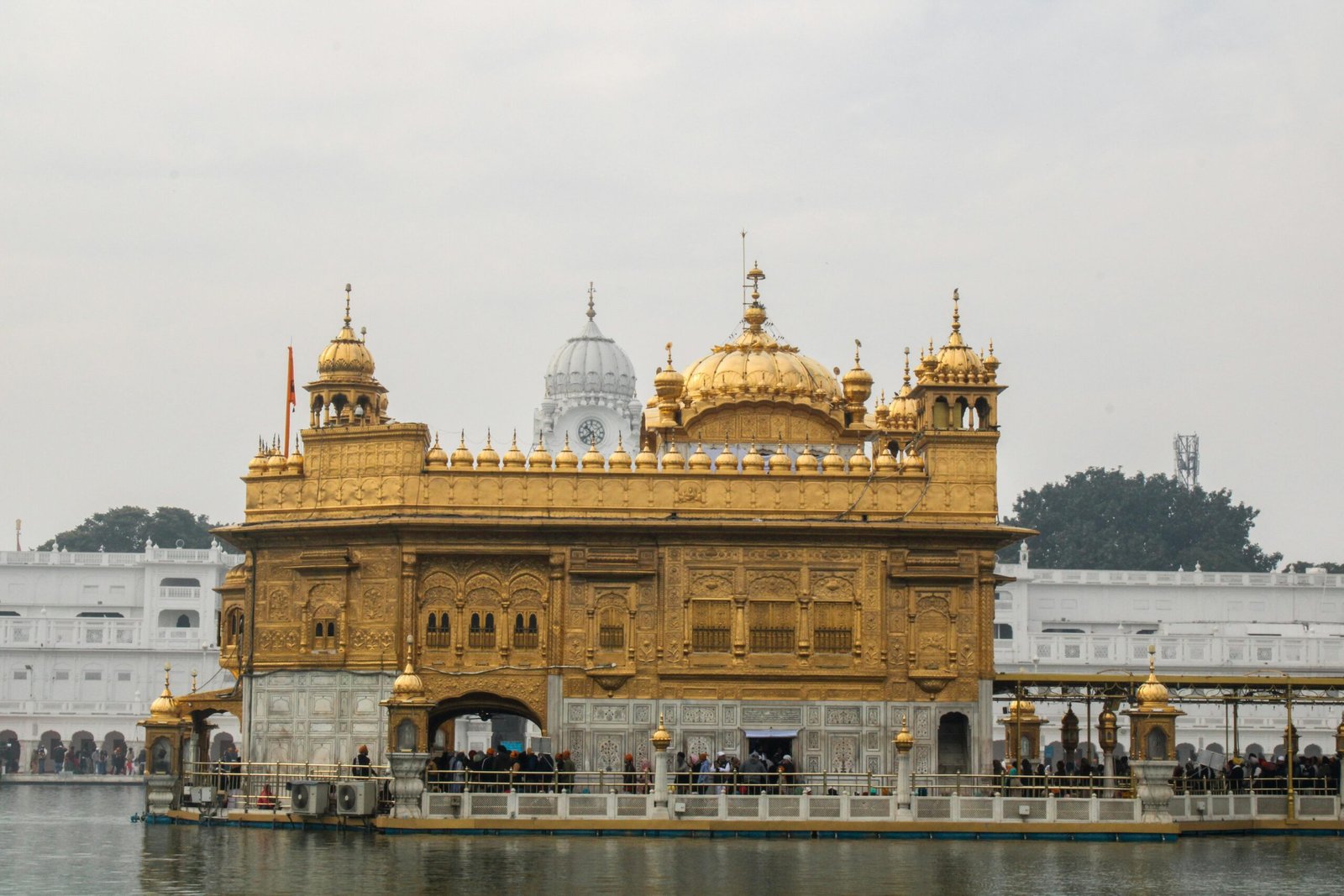 Captivating view of the Golden Temple, Amritsar reflecting in the surrounding water.
